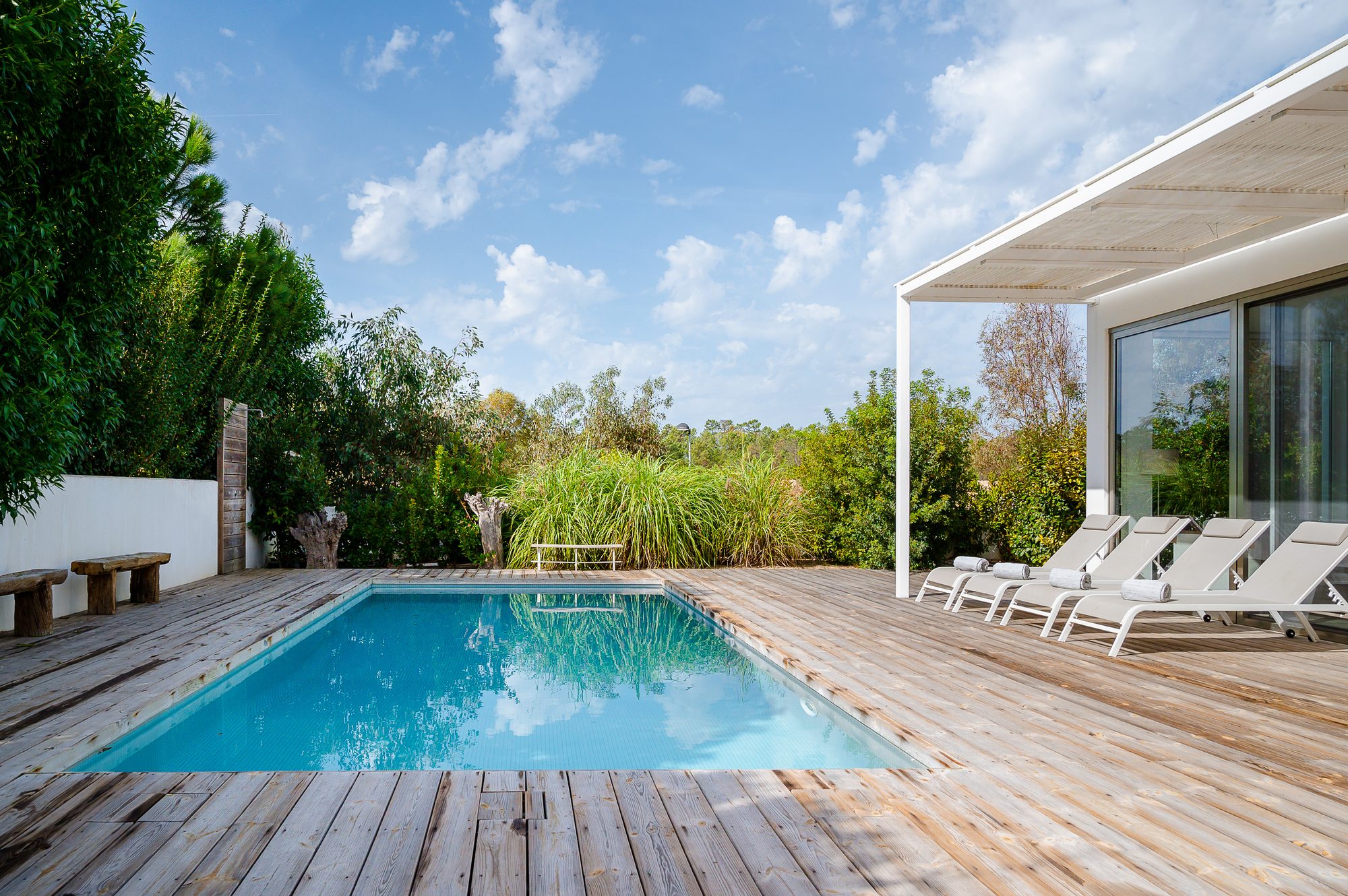 Villa Laranjeiras private heated saltwater pool and sun deck in Comporta